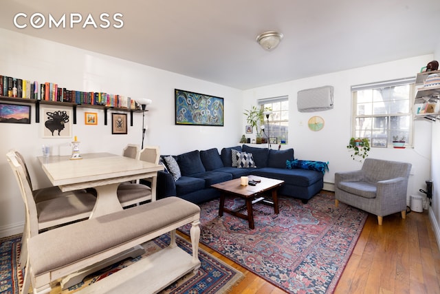 living area with hardwood / wood-style floors