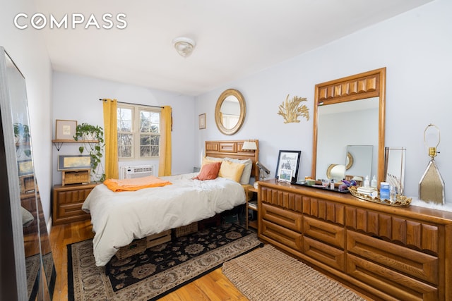 bedroom featuring wood finished floors