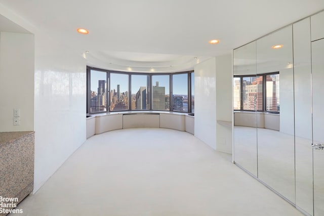 330 E 38th St Unit 51Ef, New York City, NY 10016 - unfurnished room with a skyline view and recessed lighting