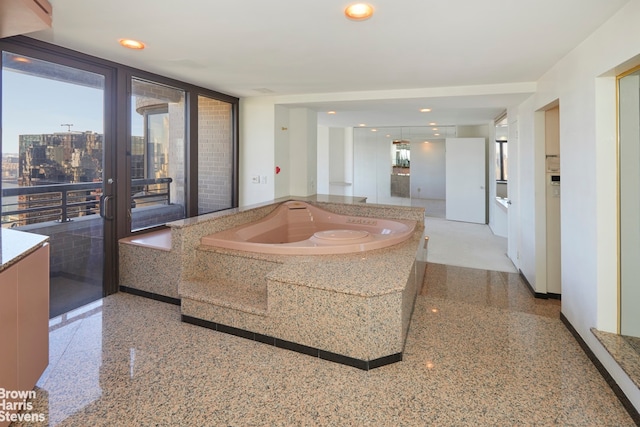 330 E 38th St Unit 51Ef, New York City, NY 10016 - bathroom featuring a bath, french doors, and recessed lighting
