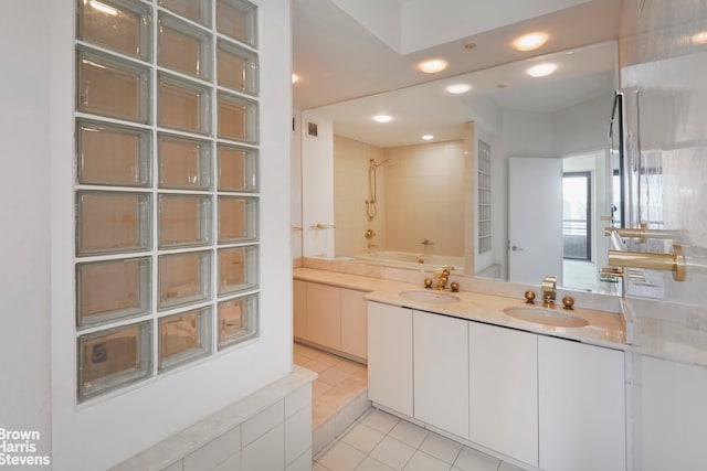330 E 38th St Unit 51Ef, New York City, NY 10016 - bathroom featuring a tub to relax in, tile patterned flooring, double vanity, a shower, and recessed lighting
