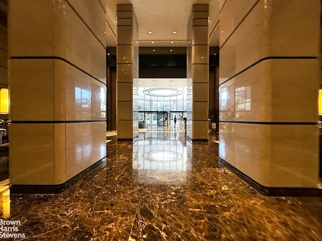 330 E 38th St Unit 51Ef, New York City, NY 10016 - corridor featuring a high ceiling and marble tiled floors