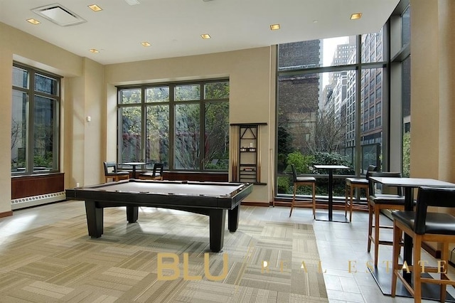 101 W 24th St Unit 37-B, New York City, NY 10011 - playroom with healthy amount of natural light, a baseboard heating unit, billiards, and recessed lighting