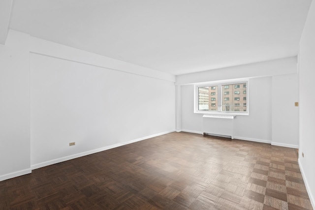 235 Adams St Unit 6A, New York City, NY 11201 - empty room featuring baseboards and radiator