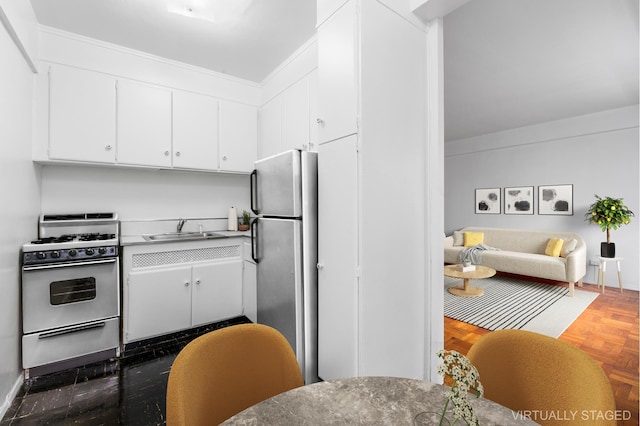 235 Adams St Unit 6A, New York City, NY 11201 - kitchen featuring a sink, freestanding refrigerator, white gas range oven, and white cabinetry