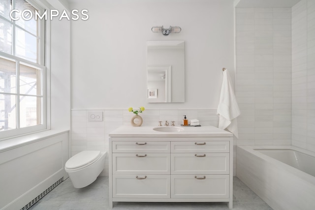 full bathroom featuring plenty of natural light, toilet, vanity, tile walls, and tile patterned flooring