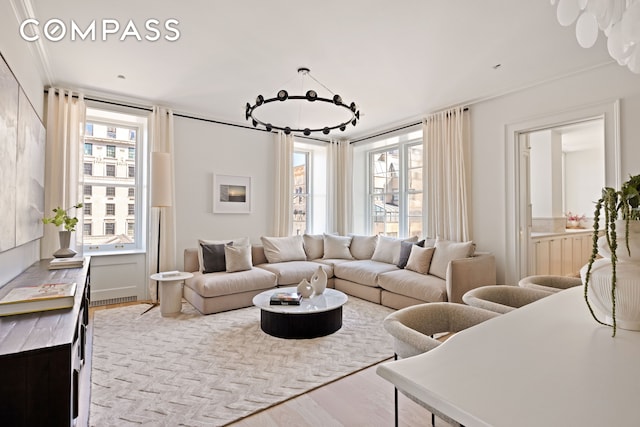 living area featuring wood finished floors and plenty of natural light