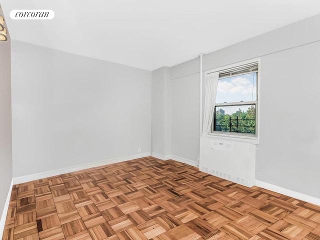 empty room featuring visible vents and baseboards
