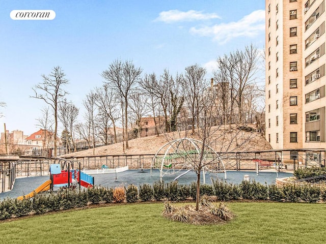 view of property's community with a yard, fence, and visible vents