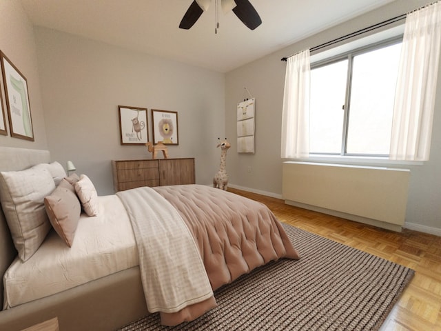 330 W 145th St Unit 503, New York City, NY 10039 - bedroom with baseboards, radiator, and a ceiling fan