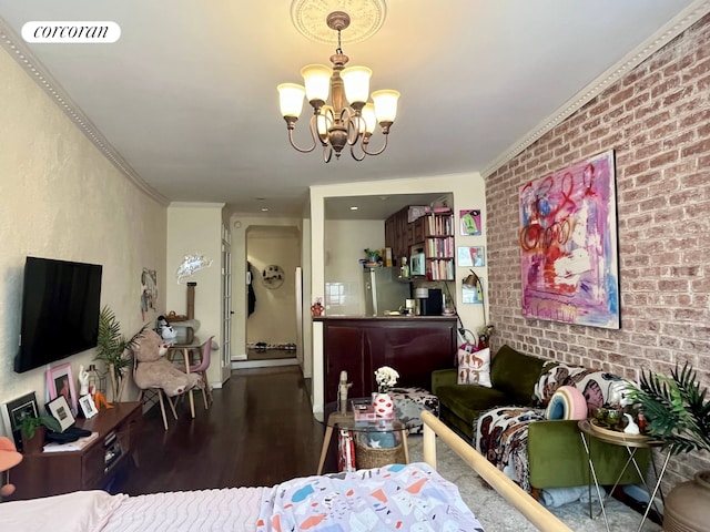 304 E 73rd St Unit 5E, New York City, NY 10021 - living area with wood finished floors, a chandelier, brick wall, and ornamental molding