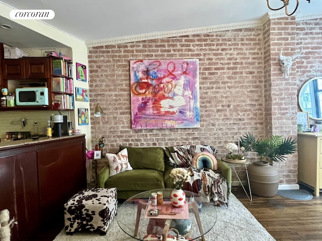 304 E 73rd St Unit 5E, New York City, NY 10021 - living area with brick wall and wood finished floors