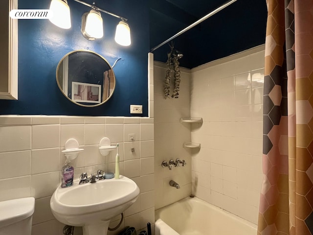 304 E 73rd St Unit 5E, New York City, NY 10021 - full bath with shower / bath combination with curtain, a sink, toilet, and tile walls