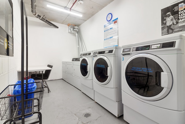 common laundry area with separate washer and dryer