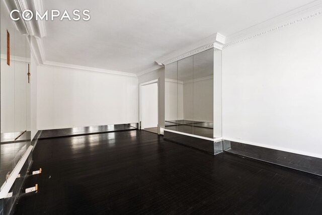 45 E 66th St Unit 4Nw, New York City, NY 10065 - unfurnished room with ornamental molding and wood finished floors