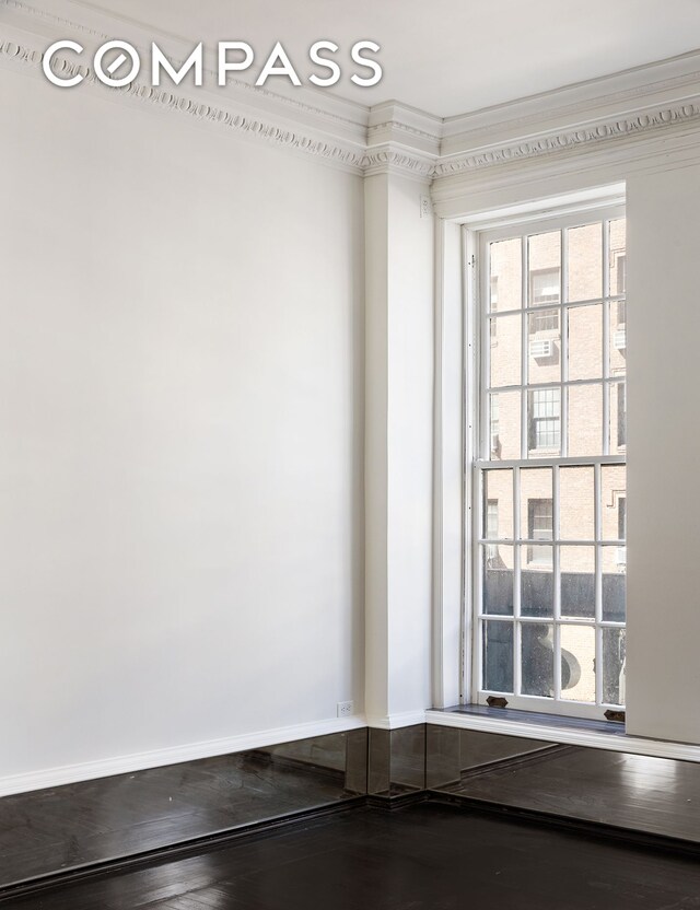 45 E 66th St Unit 4Nw, New York City, NY 10065 - unfurnished room featuring crown molding and baseboards
