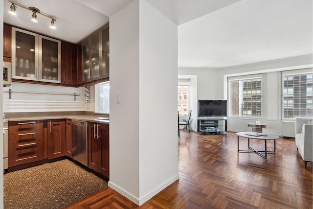 bar area with dishwasher, baseboards, healthy amount of natural light, and white microwave