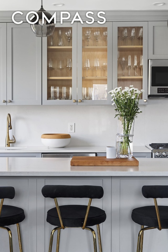 175 W 93rd St Unit 10C, New York City, NY 10025 - bar featuring stainless steel microwave and a sink