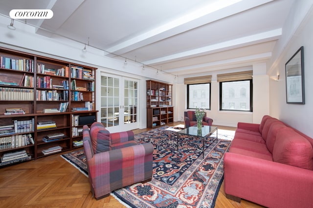 400 W End Ave Unit 13A, New York City, NY 10024 - living area with french doors, rail lighting, and beam ceiling