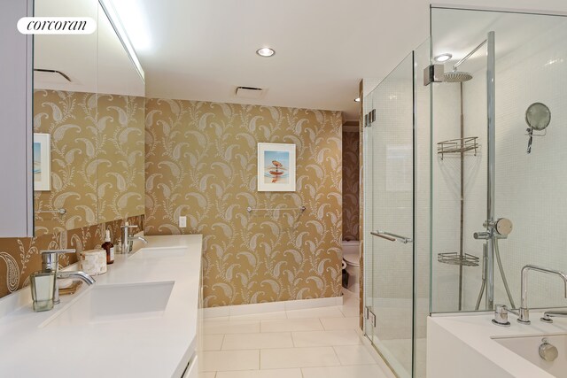 425 W 53rd St Unit 412, New York City, NY 10019 - full bath featuring toilet, wallpapered walls, a sink, and tile patterned floors