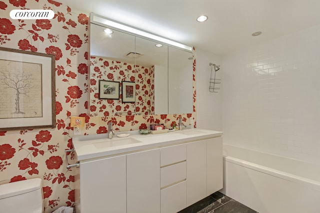 425 W 53rd St Unit 412, New York City, NY 10019 - bathroom featuring toilet, wallpapered walls, recessed lighting, and a sink