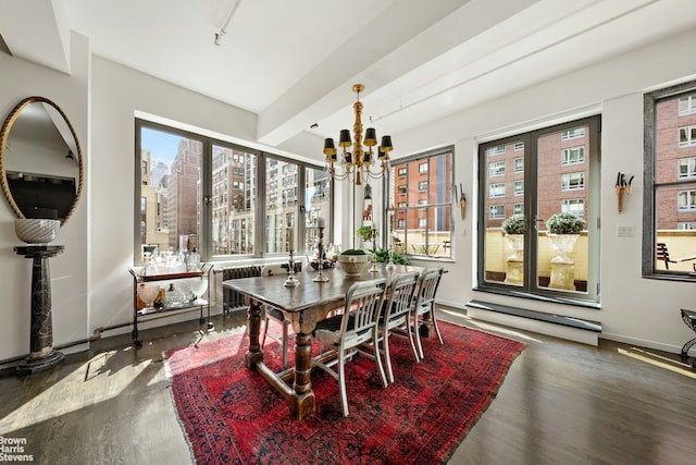 347 W 39th St Unit 8E, New York City, NY 10018 - dining room with wood finished floors, a chandelier, beamed ceiling, baseboards, and radiator