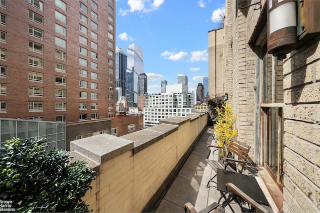 347 W 39th St Unit 8E, New York City, NY 10018 - balcony with a skyline view