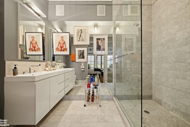 347 W 39th St Unit 8E, New York City, NY 10018 - bathroom featuring double vanity, a walk in shower, and toilet