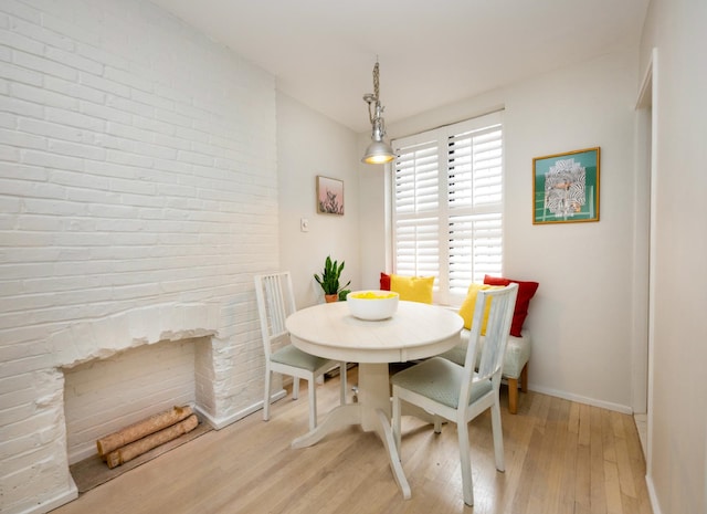 328 W 17th St Unit 5E, New York City, NY 10011 - dining area featuring light wood-style flooring and baseboards