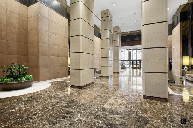330 E 38th St Unit 26-A, New York City, NY 10016 - building lobby with a towering ceiling and recessed lighting