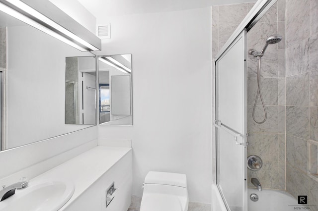 330 E 38th St Unit 26-A, New York City, NY 10016 - full bathroom featuring toilet, vanity, and enclosed tub / shower combo