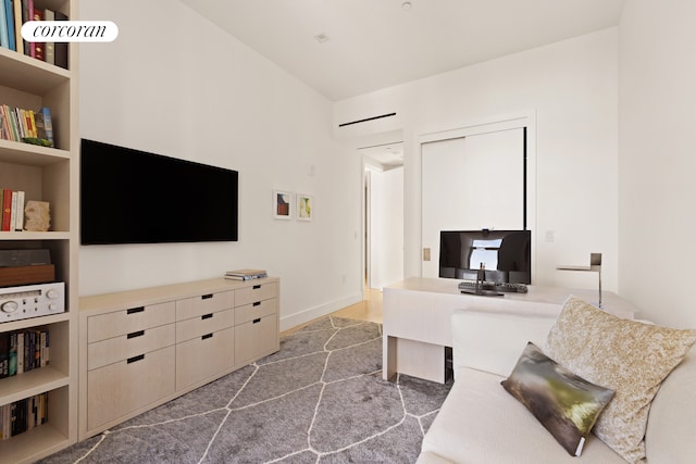 living room featuring an office area and built in features