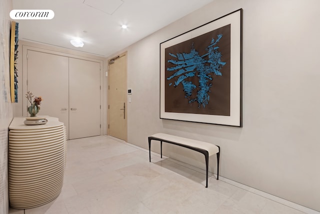 corridor featuring baseboards