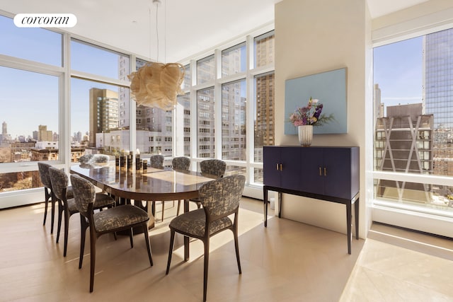 dining space featuring a view of city