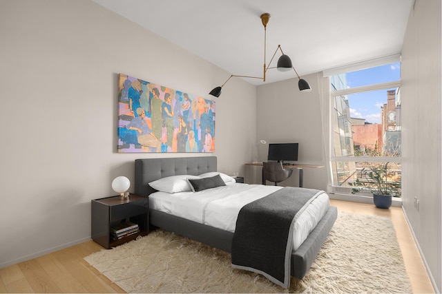 245 10th Ave Unit 3W, New York City, NY 10001 - bedroom featuring wood finished floors and baseboards