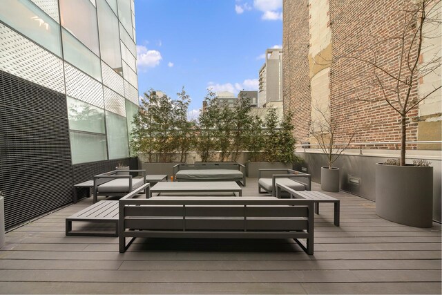 245 10th Ave Unit 3W, New York City, NY 10001 - wooden deck featuring an outdoor hangout area