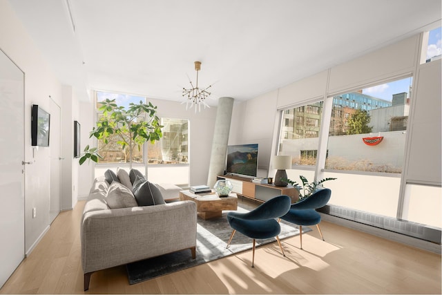 245 10th Ave Unit 3W, New York City, NY 10001 - living area with a chandelier and light wood-style floors