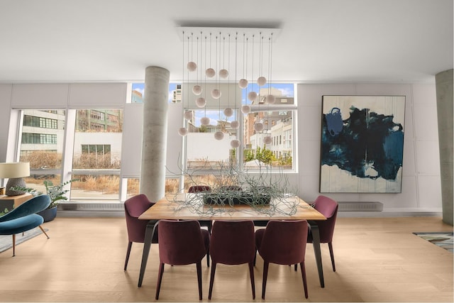 245 10th Ave Unit 3W, New York City, NY 10001 - dining space with wood finished floors and healthy amount of natural light