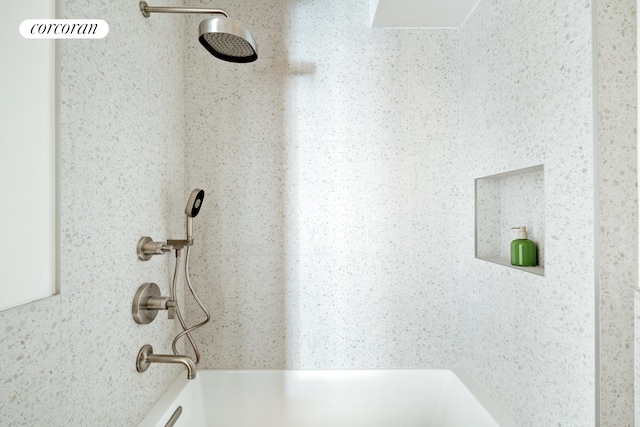 bathroom view of a shower and a tub