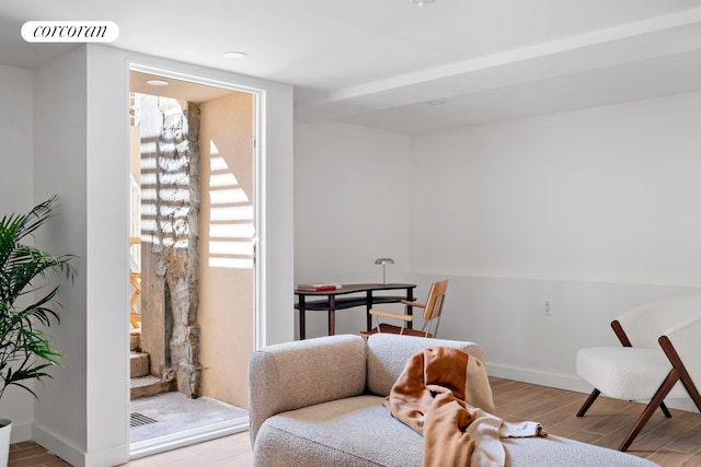sitting room featuring wood finished floors and baseboards