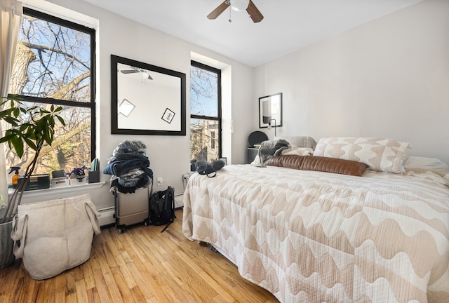 bedroom featuring ceiling fan and light wood-style flooring