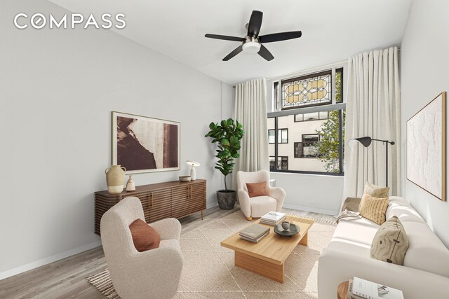 spare room with baseboards and wood finished floors