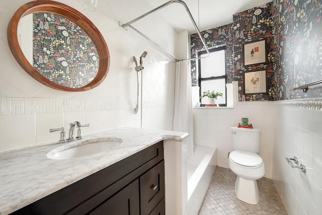 880 W 181st St Unit 2-C, New York City, NY 10033 - bathroom featuring a shower with curtain, tile walls, tile patterned flooring, vanity, and toilet