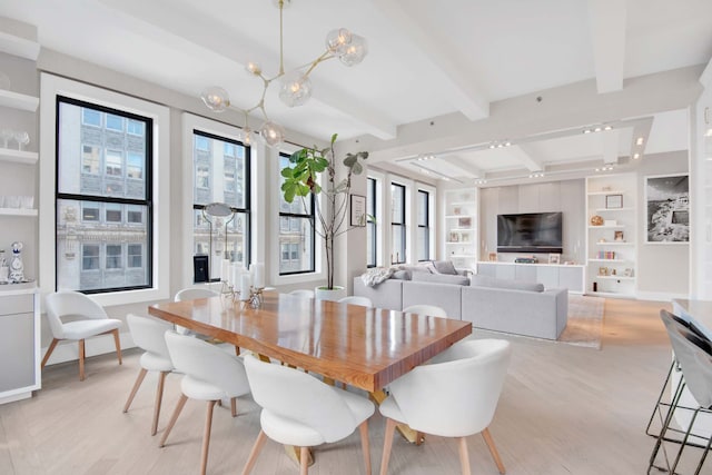 260 Park Ave S Unit 9Bc, New York City, NY 10003 - dining room with beam ceiling, light wood finished floors, a chandelier, and built in shelves