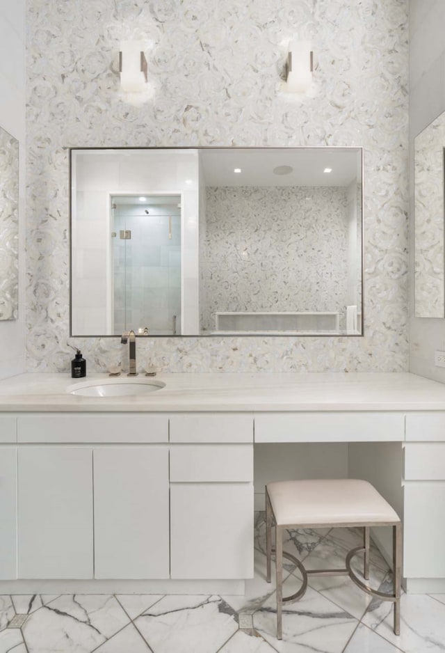 260 Park Ave S Unit 9Bc, New York City, NY 10003 - bathroom with marble look tiles, vanity, and a shower stall