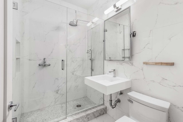 260 Park Ave S Unit 9Bc, New York City, NY 10003 - bathroom featuring a marble finish shower and tile walls