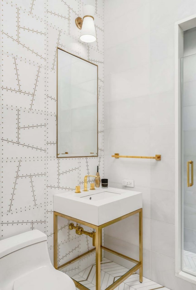 260 Park Ave S Unit 9Bc, New York City, NY 10003 - bathroom featuring tile walls, a shower stall, and vanity