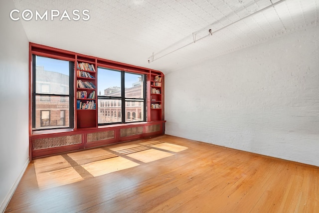27 Bleecker St Unit 6B, New York City, NY 10012 - empty room with hardwood / wood-style flooring
