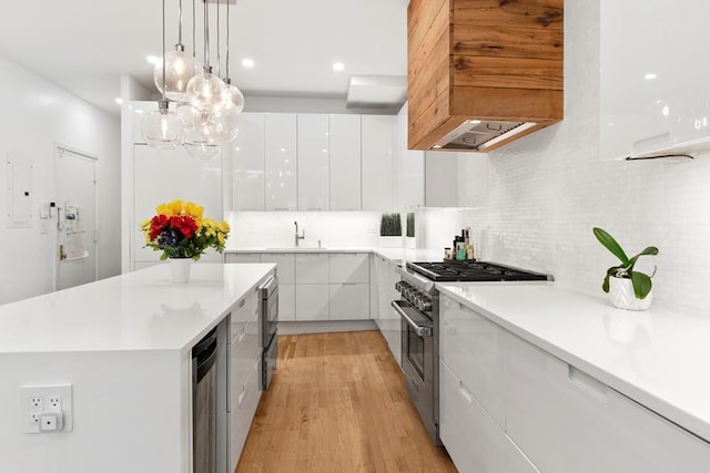 414 W 51st St Unit 2A, New York City, NY 10019 - kitchen with modern cabinets, high end stainless steel range, white cabinetry, and light countertops