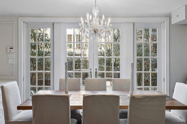 239 E 48th St, New York City, NY 10017 - dining room with a chandelier, plenty of natural light, and ornamental molding